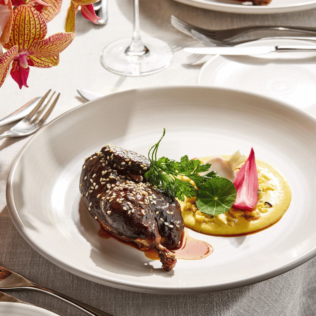 Mexican style roasted spatchcock, corn mousse, mole pablano, pickles
